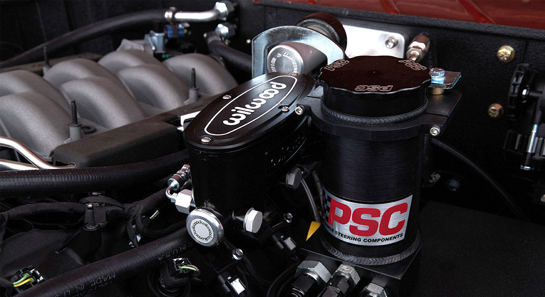 Close-up of Classic Ford Bronco engine bay showing Wilwood brake master cylinder and PSC component