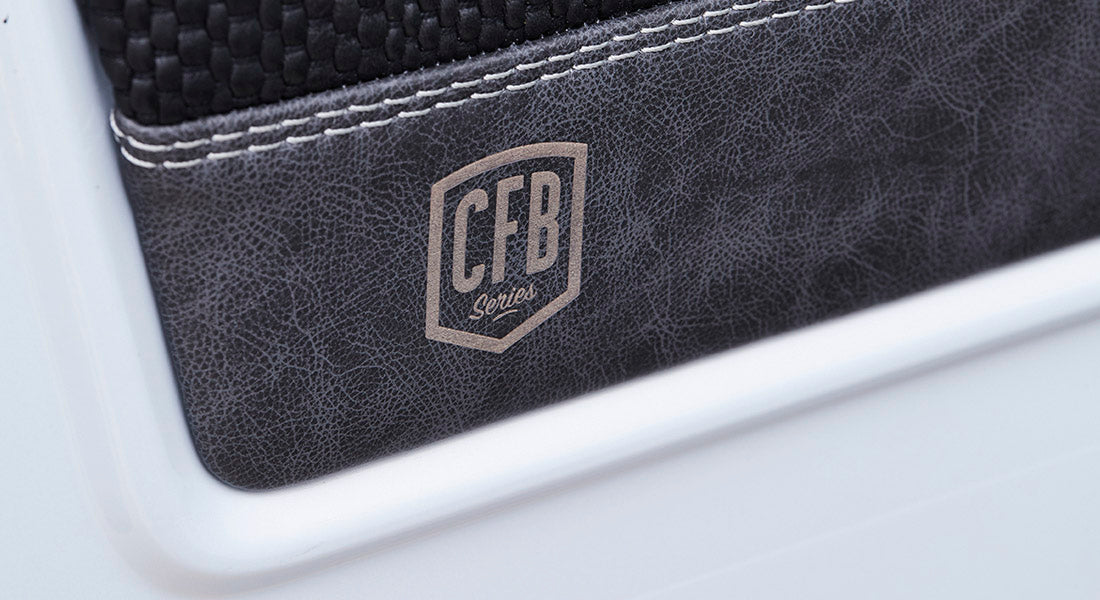 Interior panel with textured black leather section embossed with CFB Series logo