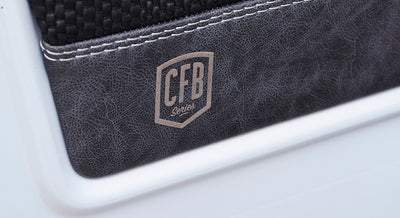 Interior panel with textured black leather section embossed with CFB Series logo