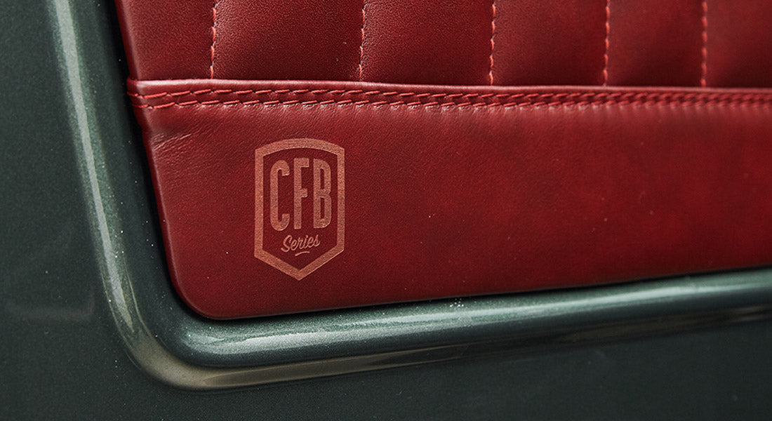 Red leather interior door panel with stitched diamond pattern and CFB Series logo