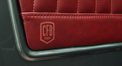 Red leather interior door panel with stitched diamond pattern and CFB Series logo