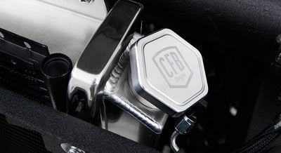 Close-up of metal component engraved with CFB Series logo in Classic Ford Bronco engine bay