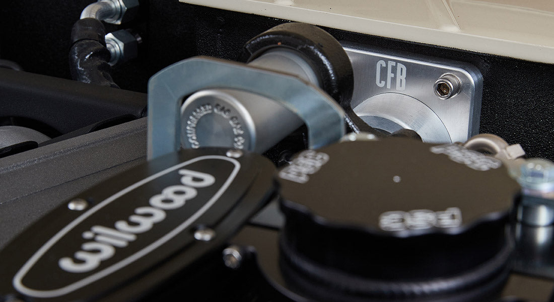 Detailed view of Wilwood brake component and CFB etched metal part inside Classic Ford Bronco