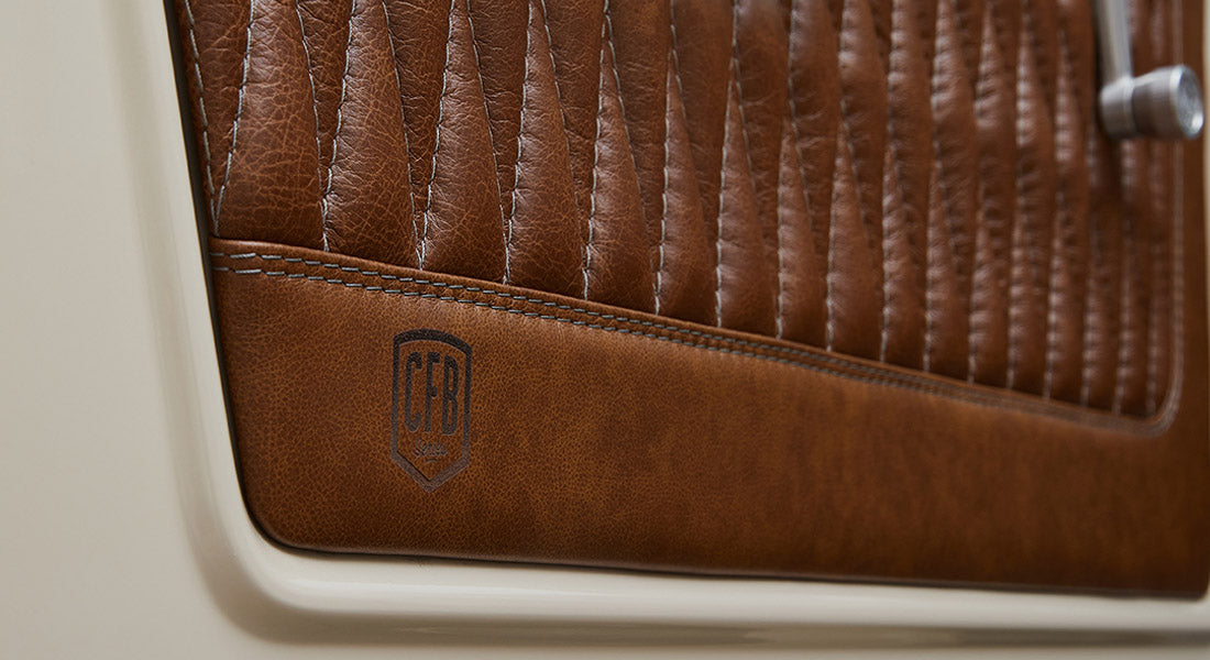 Brown leather door panel with embossed CFB logo in Classic Ford Bronco