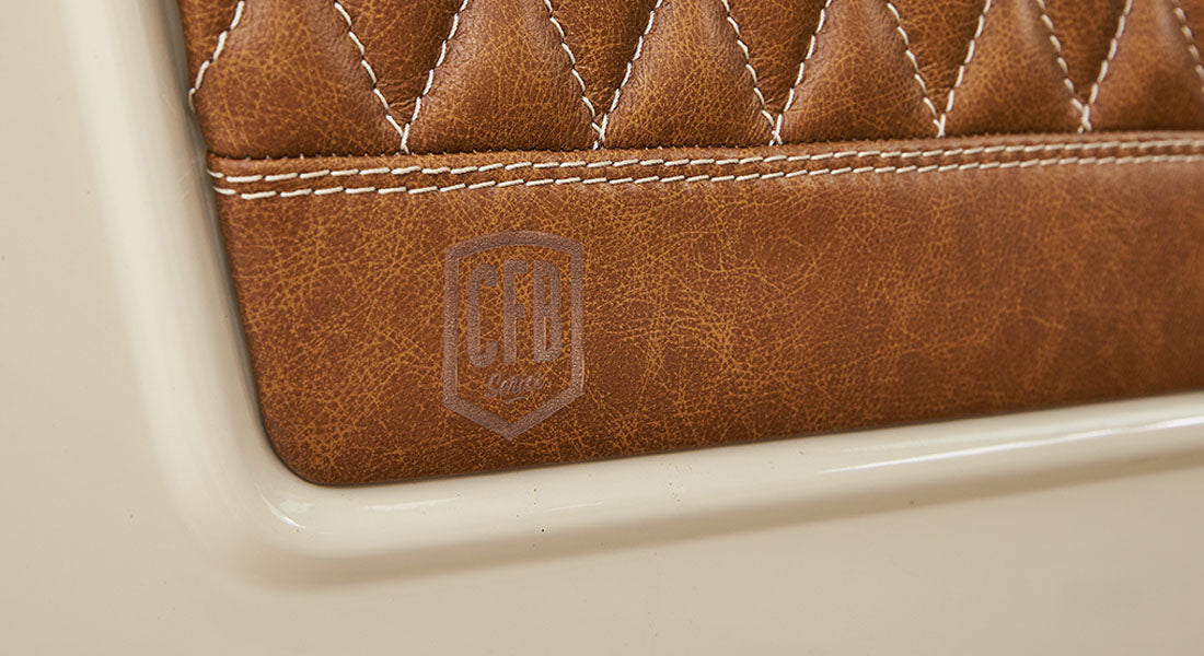 Brown leather interior door panel with stitched diamond pattern and CFB Series logo