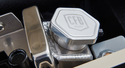 Aluminum radiator cap with 'CFB Series' branding inside Classic Ford Bronco engine bay