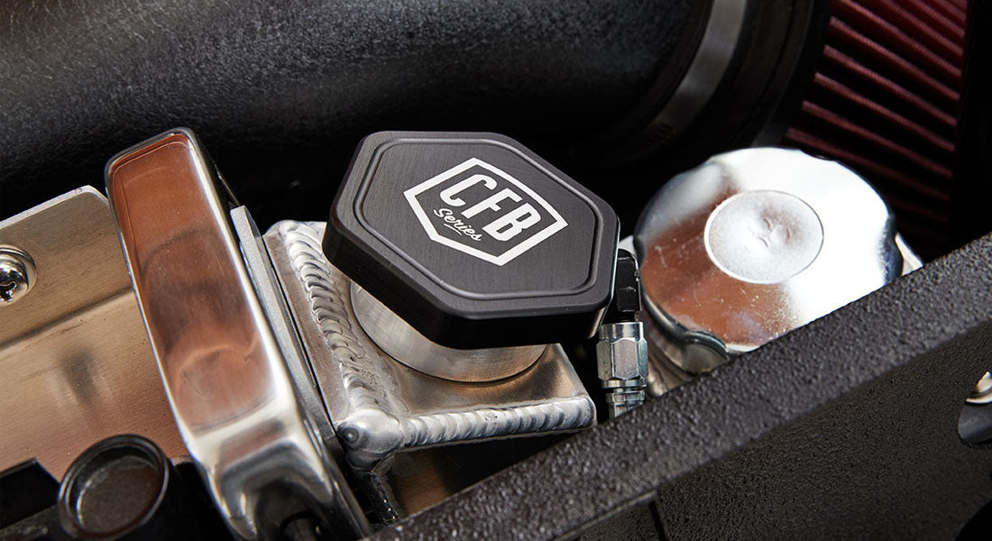 Close-up of a black cap with CFB Series logo in engine area