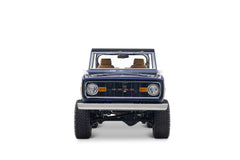 Blue Classic Ford Bronco with open top shown front view on white background