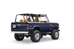 Blue Classic Ford Bronco with open top shown rear 3/4 view on white background