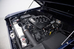 Engine bay of Classic Ford Bronco featuring modern V8 engine with Wilwood components