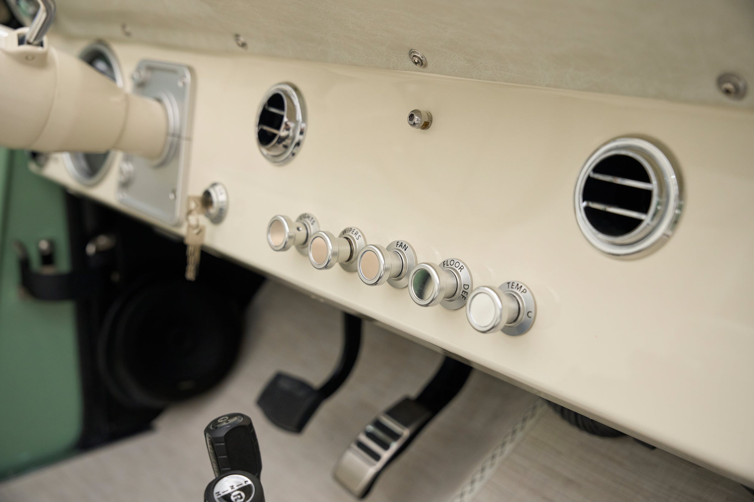 Close-up of dashboard controls and vents in classic Ford Bronco.