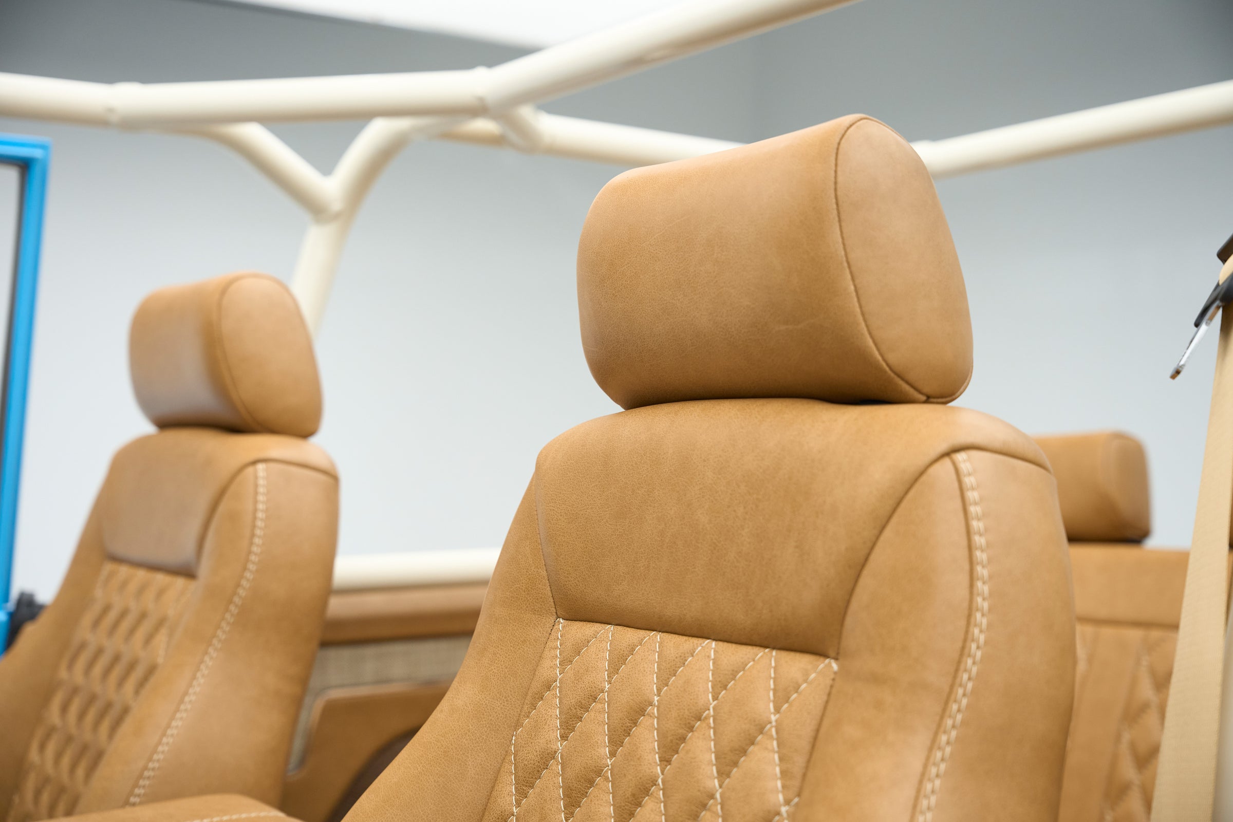 Close detail of tan leather headrests on front seats of Classic Ford Bronco