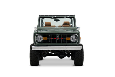 Green Classic Ford Bronco with open top shown front view on white background