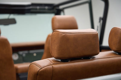 Brown leather headrests and seats interior detail inside a Classic Ford Bronco