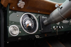 Close-up of Classic Ford Bronco dashboard showing speedometer and 'Bronco' emblem
