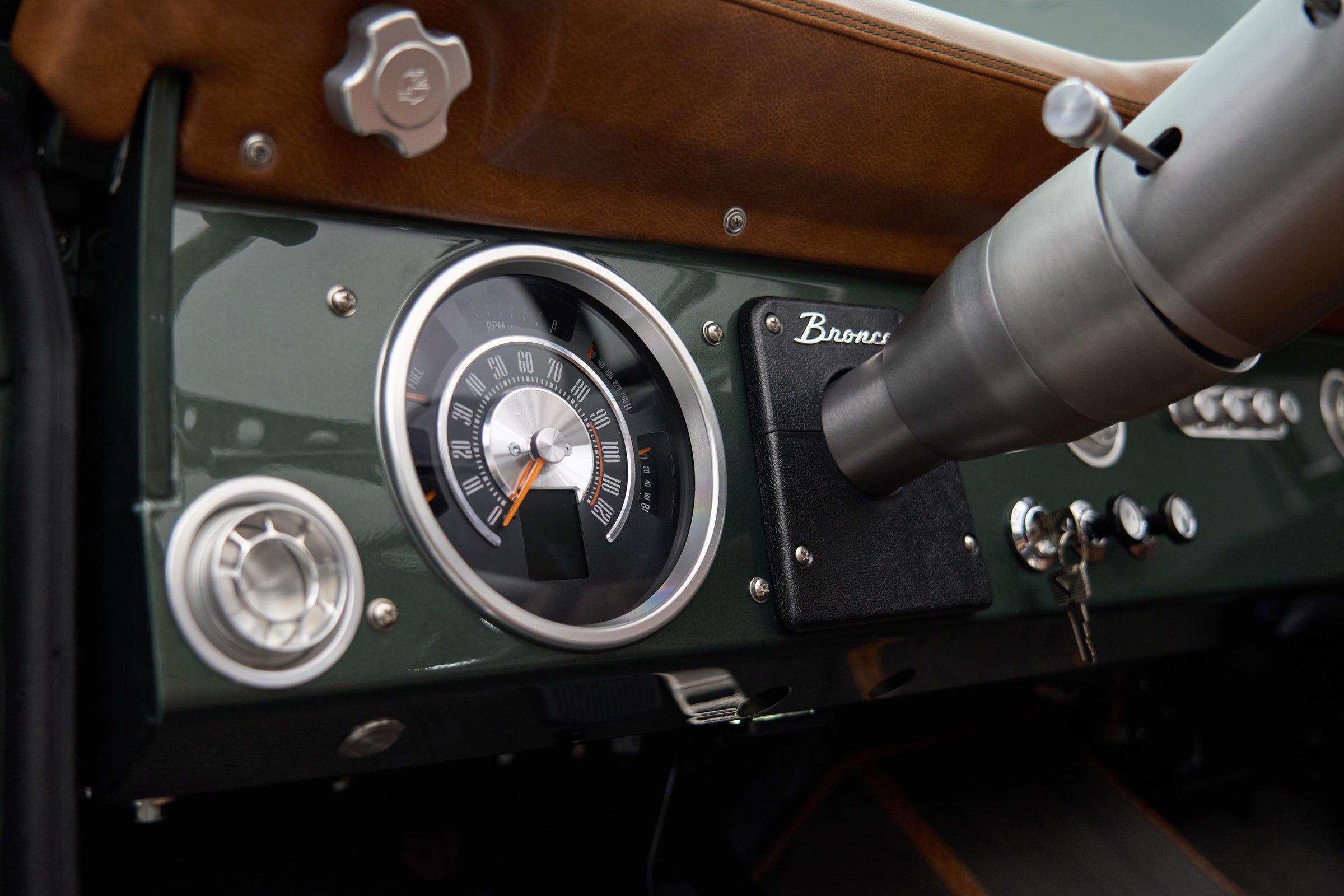 Close-up of speedometer and classic-style controls inside Classic Ford Bronco The Drover