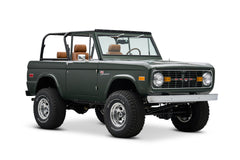 Angled front dark green Classic Ford Bronco showing grille and headlights