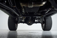 Underbody view of Classic Ford Bronco showing suspension and tires