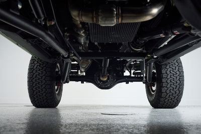 Underbody view of Classic Ford Bronco showing suspension and tires