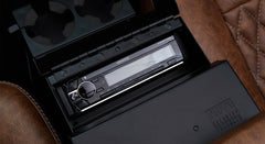 Kenwood stereo system inside center console with leather seating surrounding