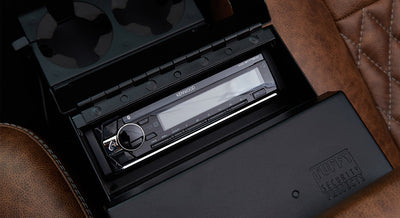 Kenwood stereo system inside center console with leather seating surrounding