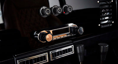 Classic Ford Bronco dashboard with vintage controls and vents in black finish
