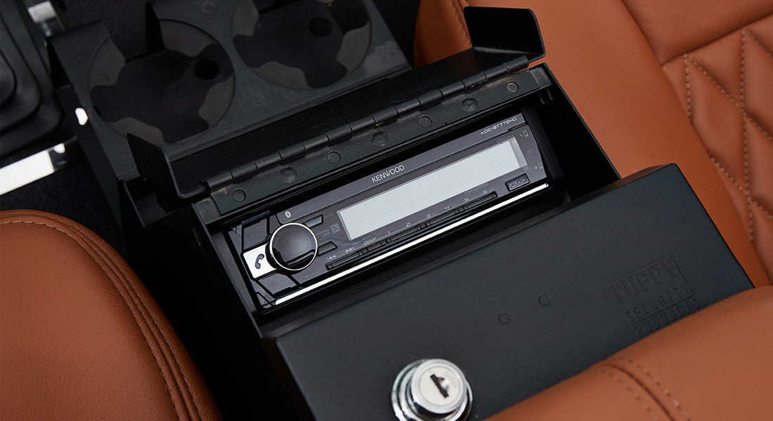 Black Kenwood stereo unit installed in Classic Ford Bronco center console