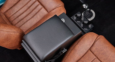 Overhead view of brown leather seats and black center console with gear shift in Classic Ford Bronco