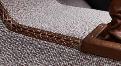 Close-up of beige carpet with leather trim inside Classic Ford Bronco