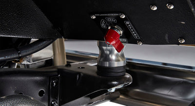 Battery switch with red toggle mounted under Classic Ford Bronco dashboard