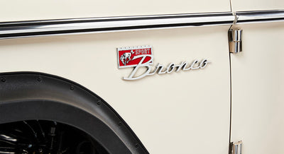 Close-up of Classic Ford Bronco Sport emblem on white body panel