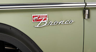 Close-up of green Classic Ford Bronco side emblem with horse and text
