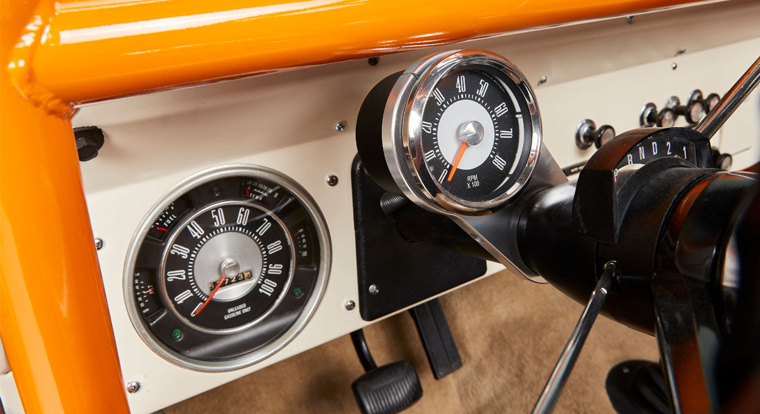 Dashboard gauges including speedometer and tachometer on Classic Ford Bronco