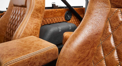 Close-up of brown quilted leather seats and center console in Classic Ford Bronco interior