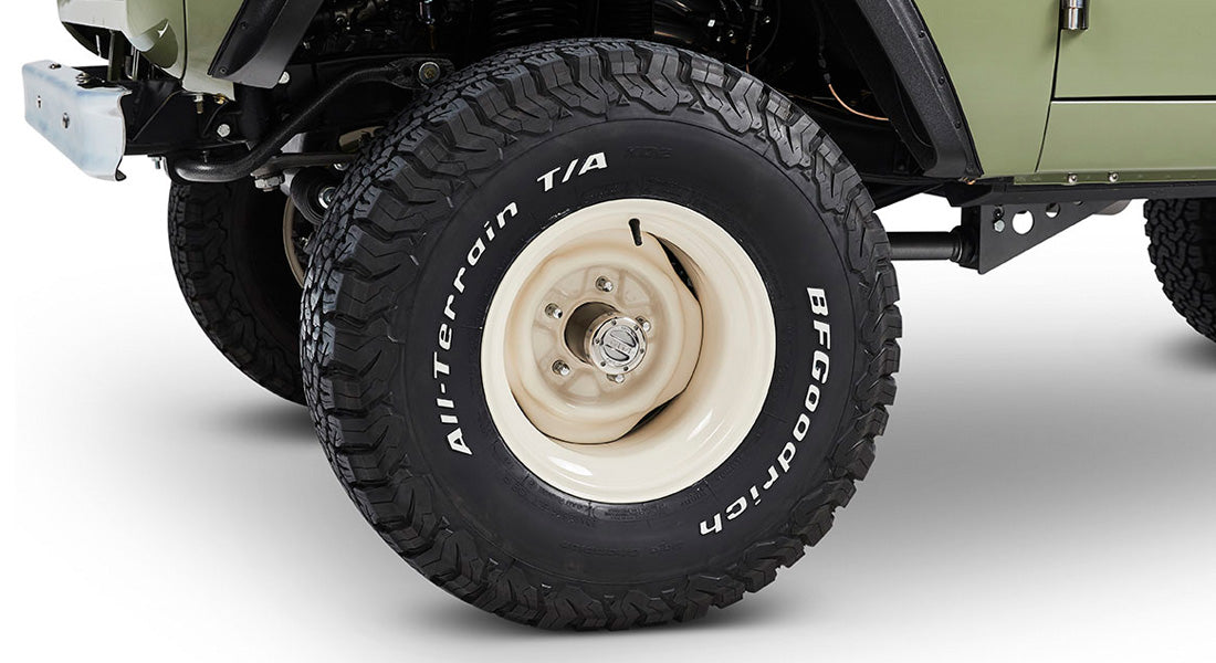 Close-up of white rim and BFGoodrich All-Terrain tire on Classic Ford Bronco