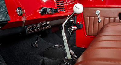 Classic Ford Bronco interior with Hurst gear shifter and brown seating