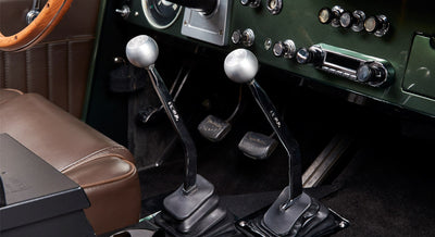 Classic Ford Bronco dashboard with speedometer and various control buttons
