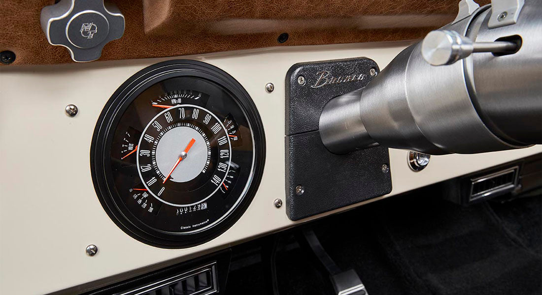 Classic Ford Bronco dashboard with detailed speedometer and Bronco nameplate