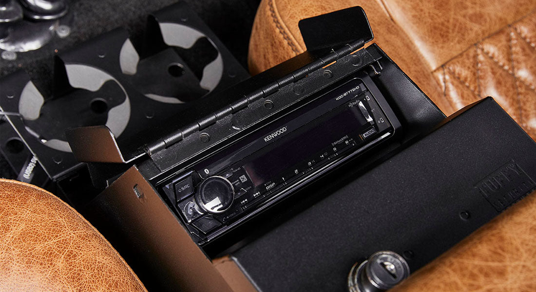 Classic Ford Bronco dashboard showing open Kenwood stereo unit