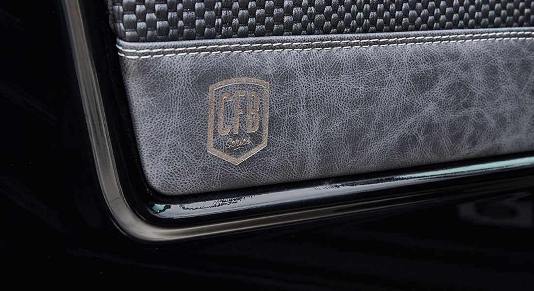Door interior panel with black and gray trim featuring a 'CFB Series' logo in Classic Ford Bronco