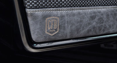 Door interior panel with black and gray trim featuring a 'CFB Series' logo in Classic Ford Bronco