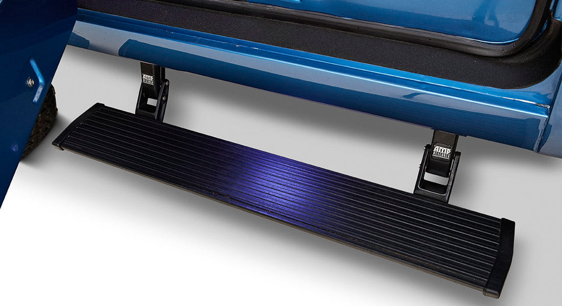 Retracted black door step attached to blue Classic Ford Bronco