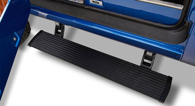 Black ribbed door step attached to the blue exterior of a Classic Ford Bronco beneath the open door.