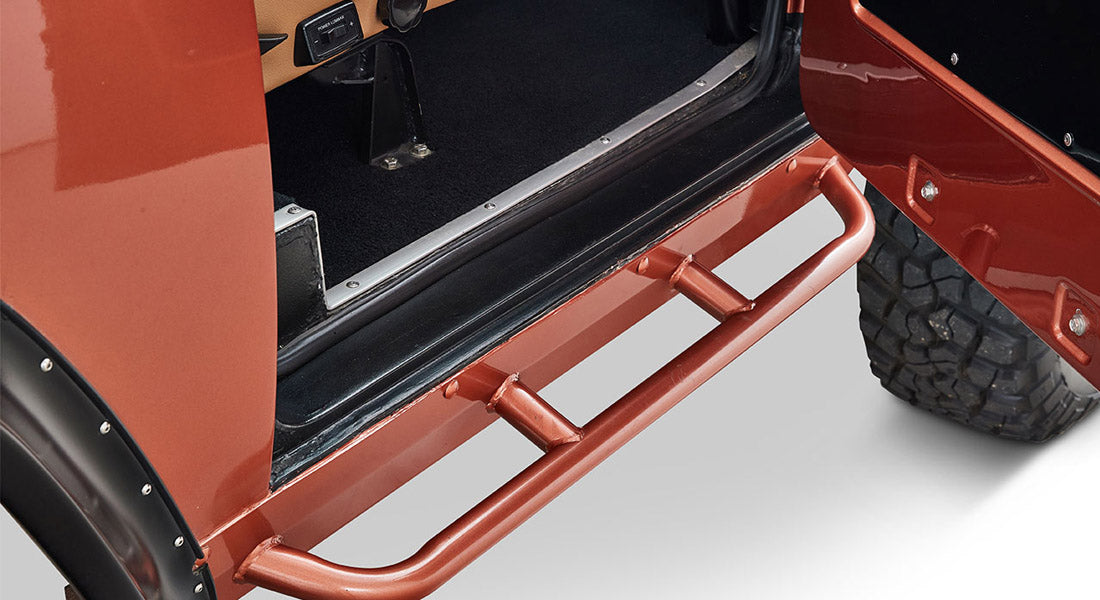 Close-up of a red metal door step on a Classic Ford Bronco