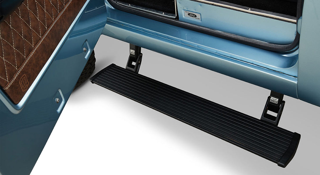 Black side step attached to open light blue Classic Ford Bronco door