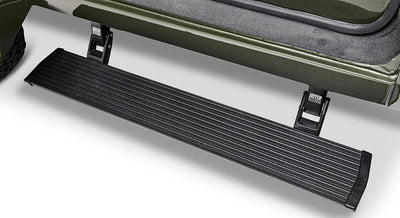 Black metal door step attached to green Classic Ford Bronco