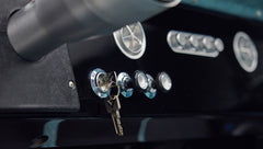 Classic Ford Bronco dashboard with ignition keys and chrome switches