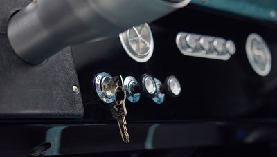 Classic Ford Bronco dashboard with ignition keys and chrome switches