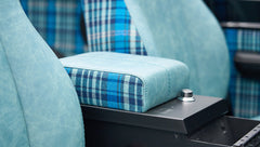 Close-up of blue and plaid armrest on Classic Ford Bronco center console