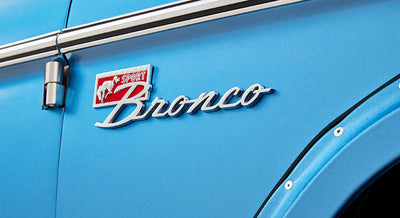 Classic Ford Bronco emblem on blue body with SPORT and horse logo